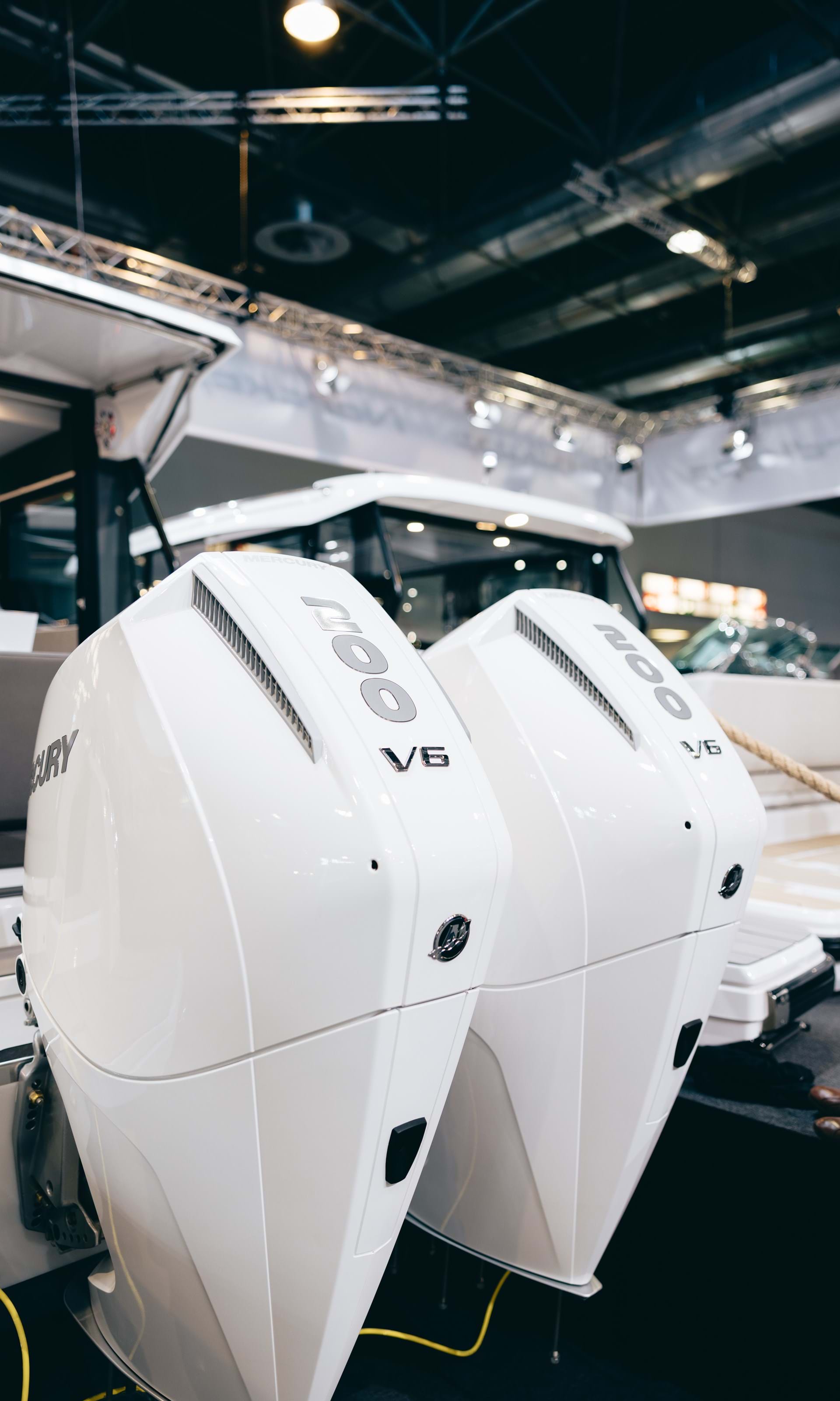 Twin 200 hp Mercury V6 outboards on the Coupe 905 wheelhouse boat.